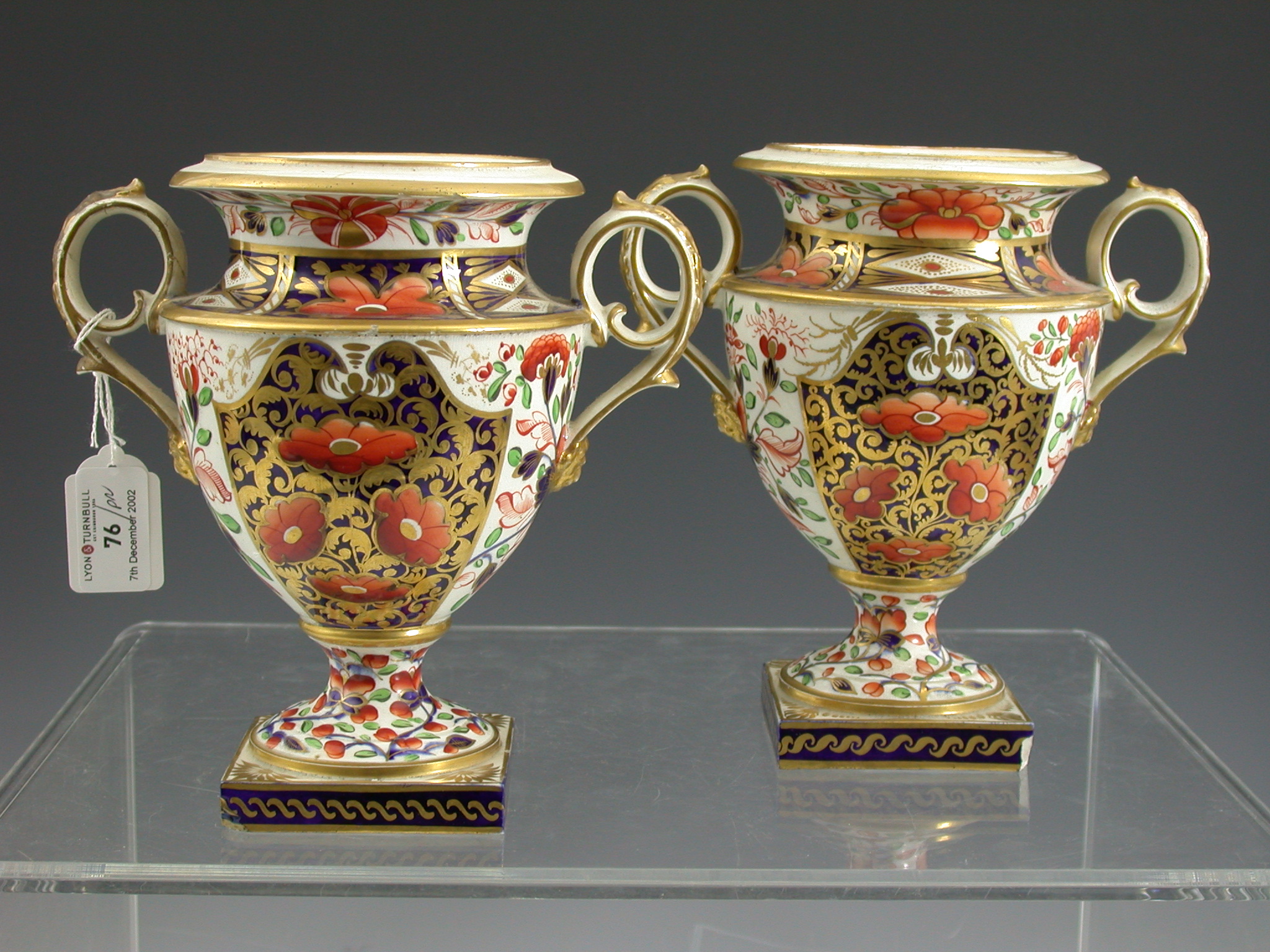 A pair of Derby Imari palette twin handled vases