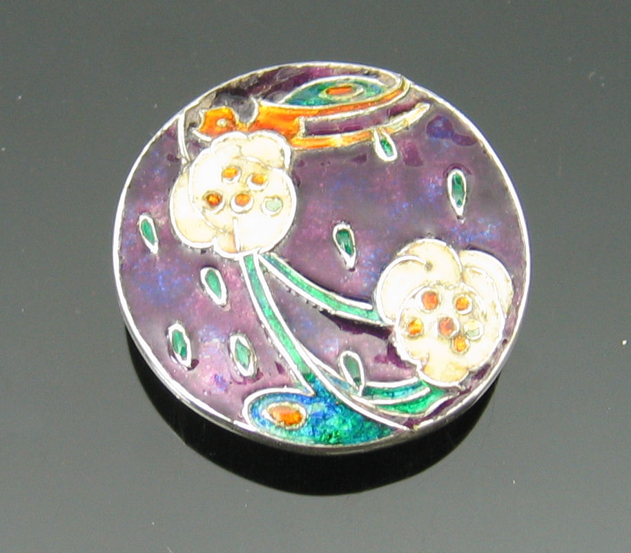 Jessie M. King (1875-1949) A rare Cymric silver and enamel brooch,