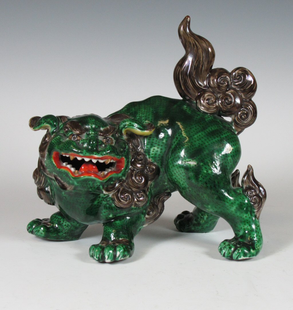 A 19th century Chinese green glazed lion dog