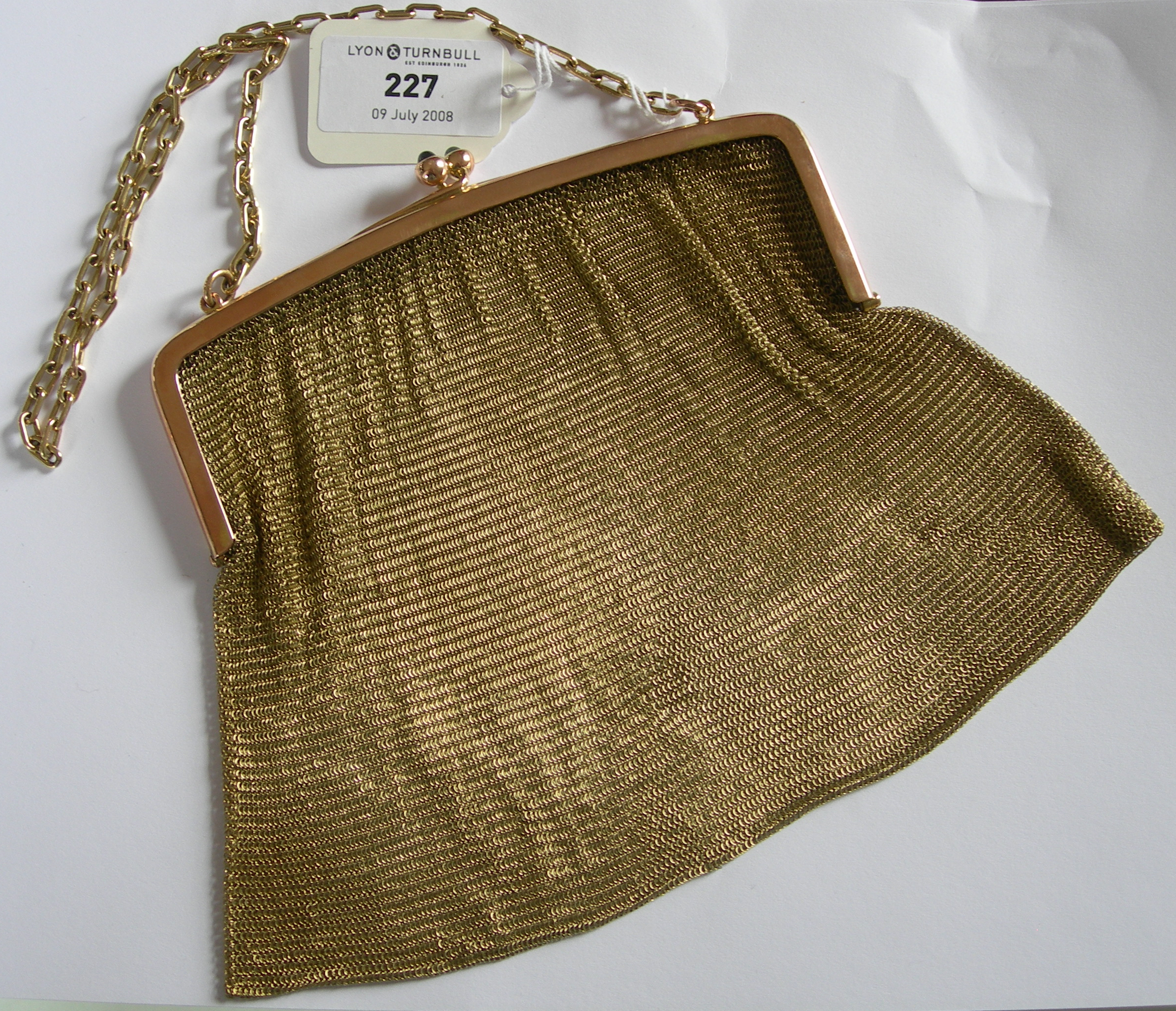 An early 20th century 9ct gold evening purse,