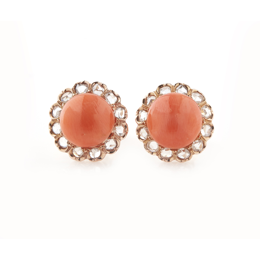 A pair of coral and diamond set earrings