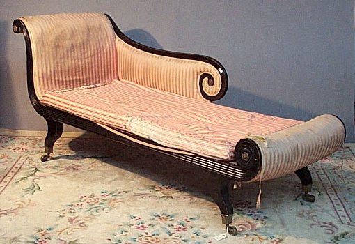 A Regency ebonised settee