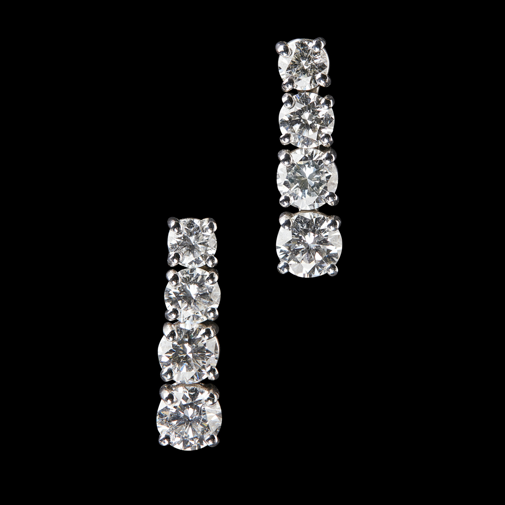 A pair of diamond set pendant earrings