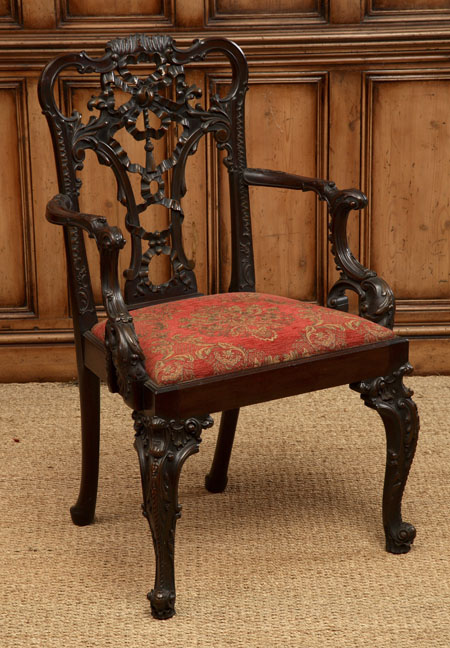 A Victorian mahogany open armchair