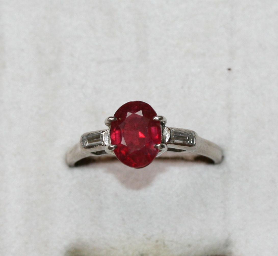 A ruby and diamond set ring