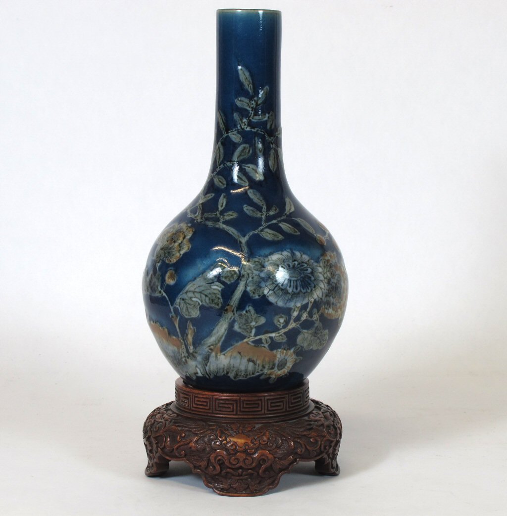 A late 19th century Chinese blue glazed bottle vase