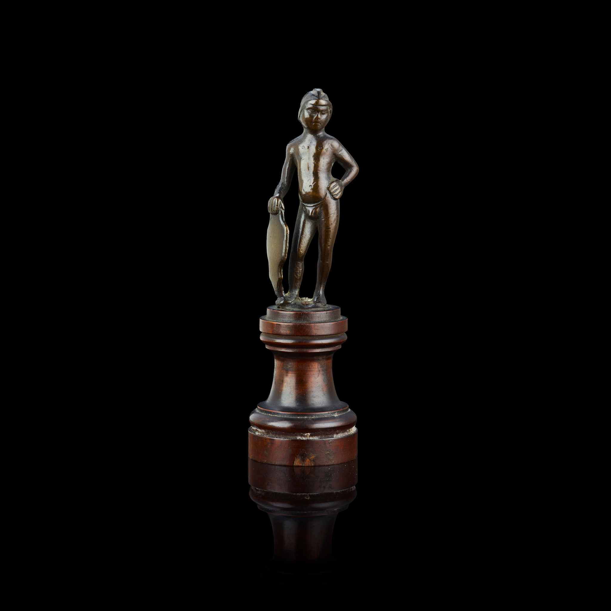 A NORTH ITALIAN SMALL BRONZE FIGURE OF A PAGE WITH A SHIELD