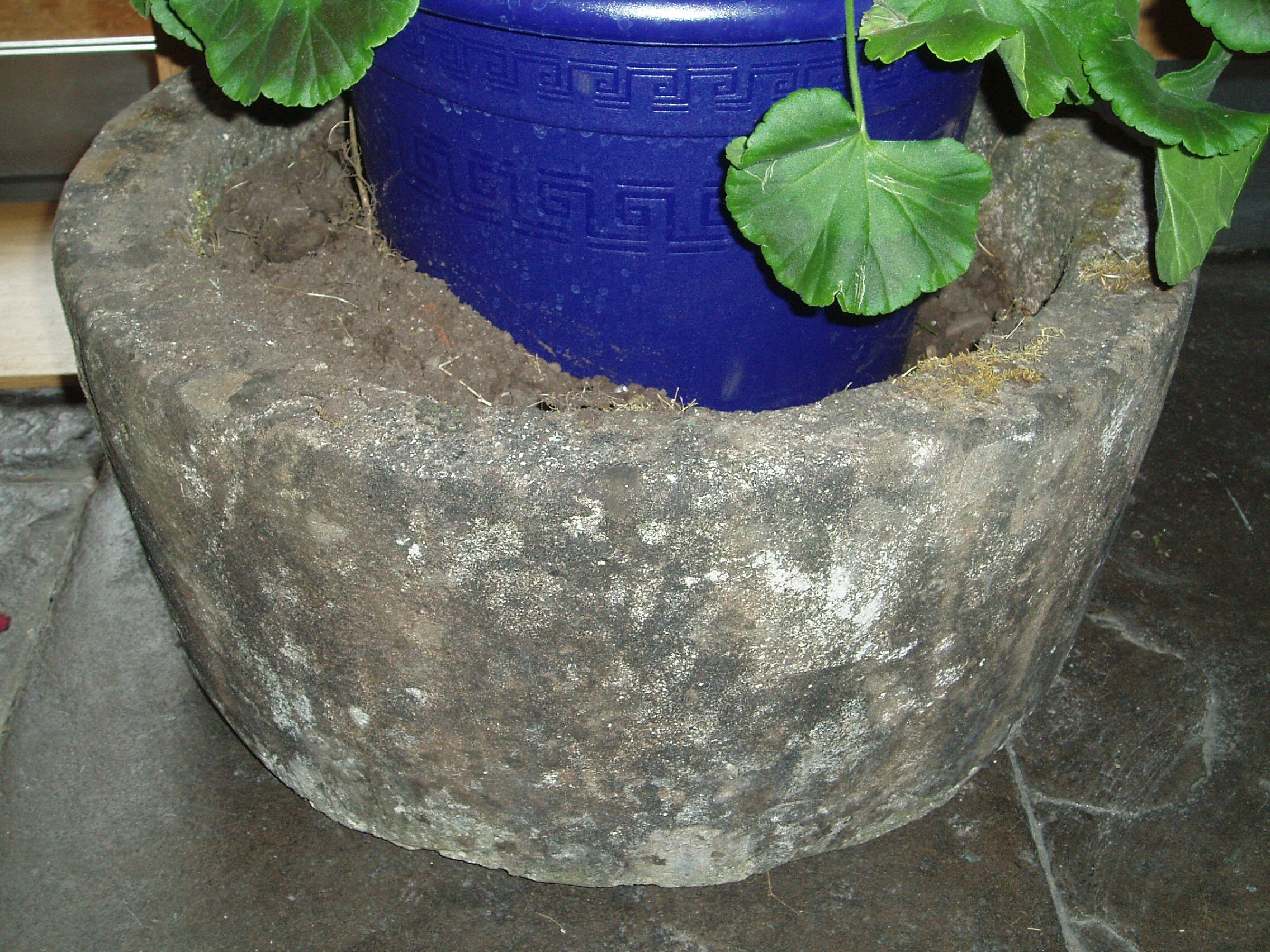A matched pair of circular composite planters,