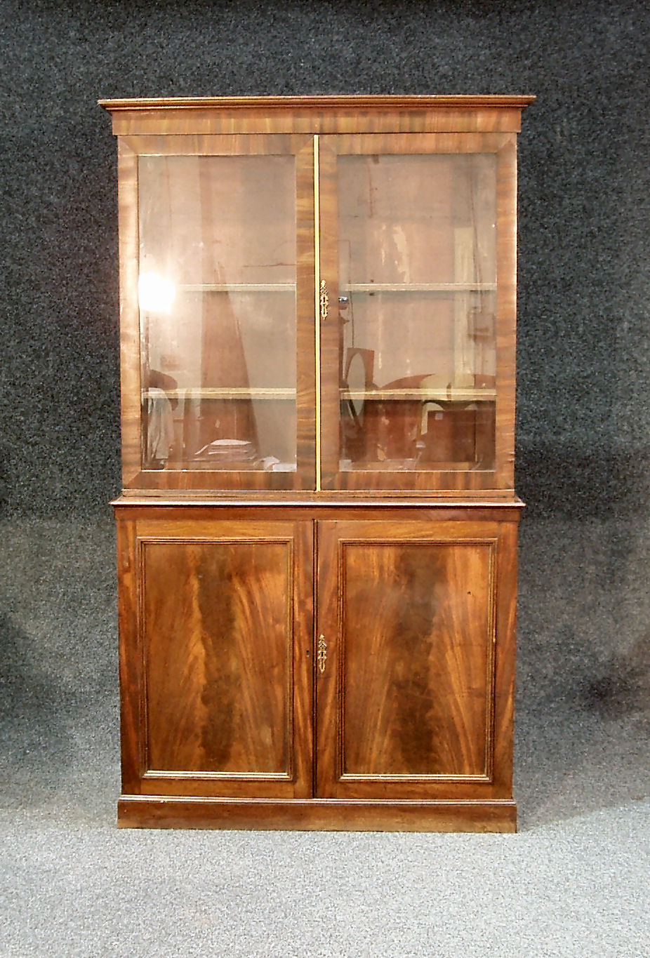 A 19th century mahogany bookcase and under-cabinet