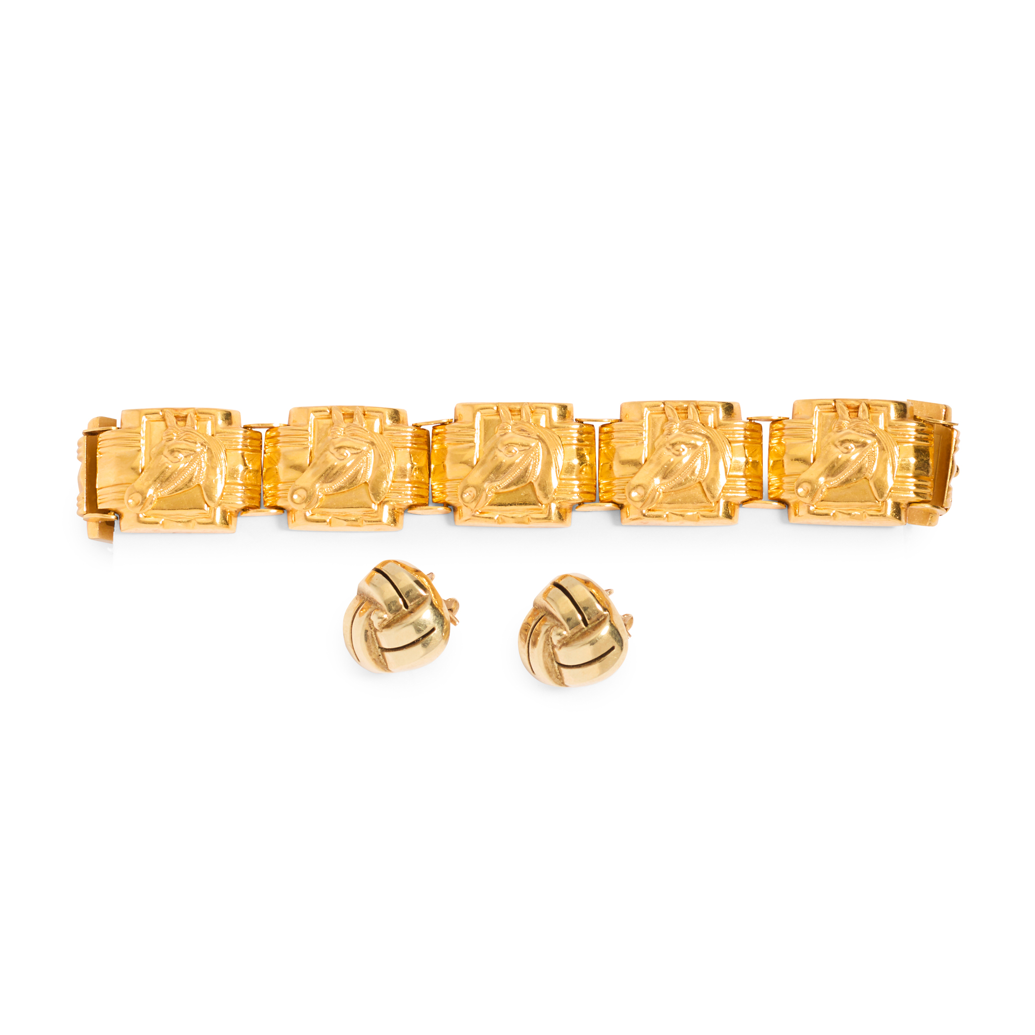 A horsehead motif bracelet and a pair of earrings