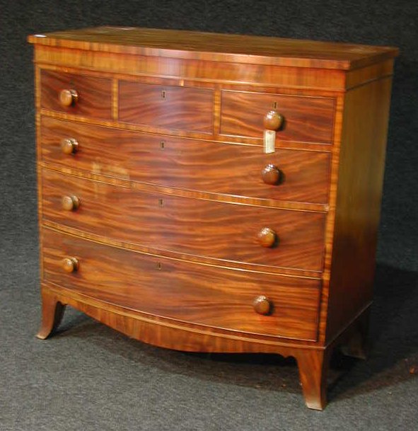 A Regency mahogany bow front chest,