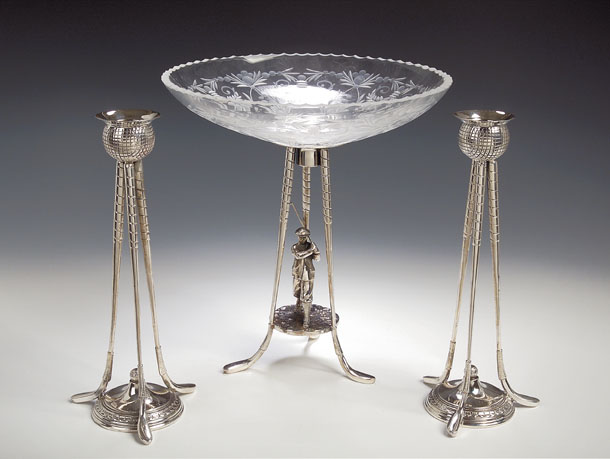 A silver plated golfing comport stand,