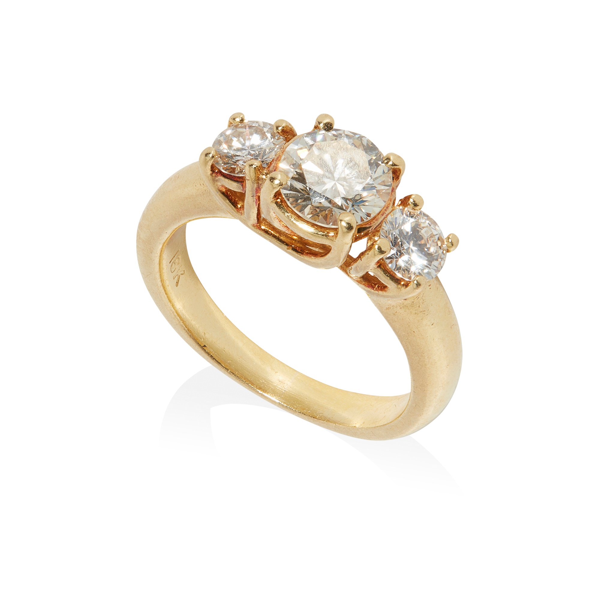 A three-stone diamond ring in 18ct yellow gold