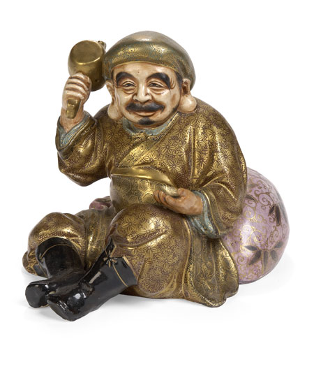A Japanese satsuma figure of Daikoku By Maruji