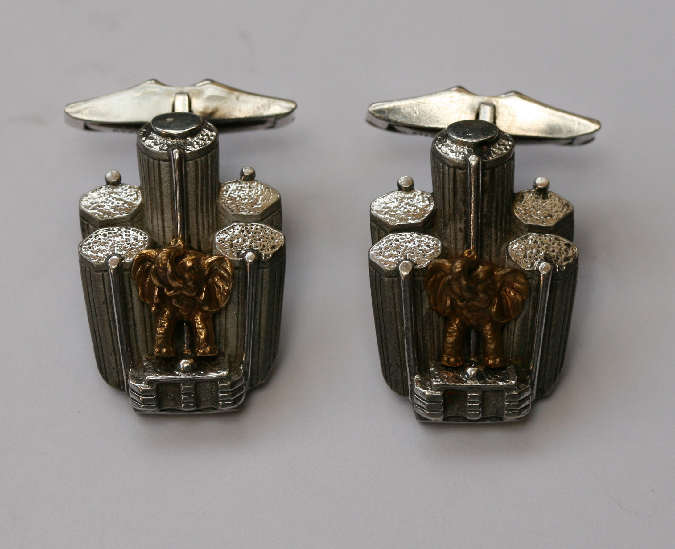 A pair of two-coloured cufflinks