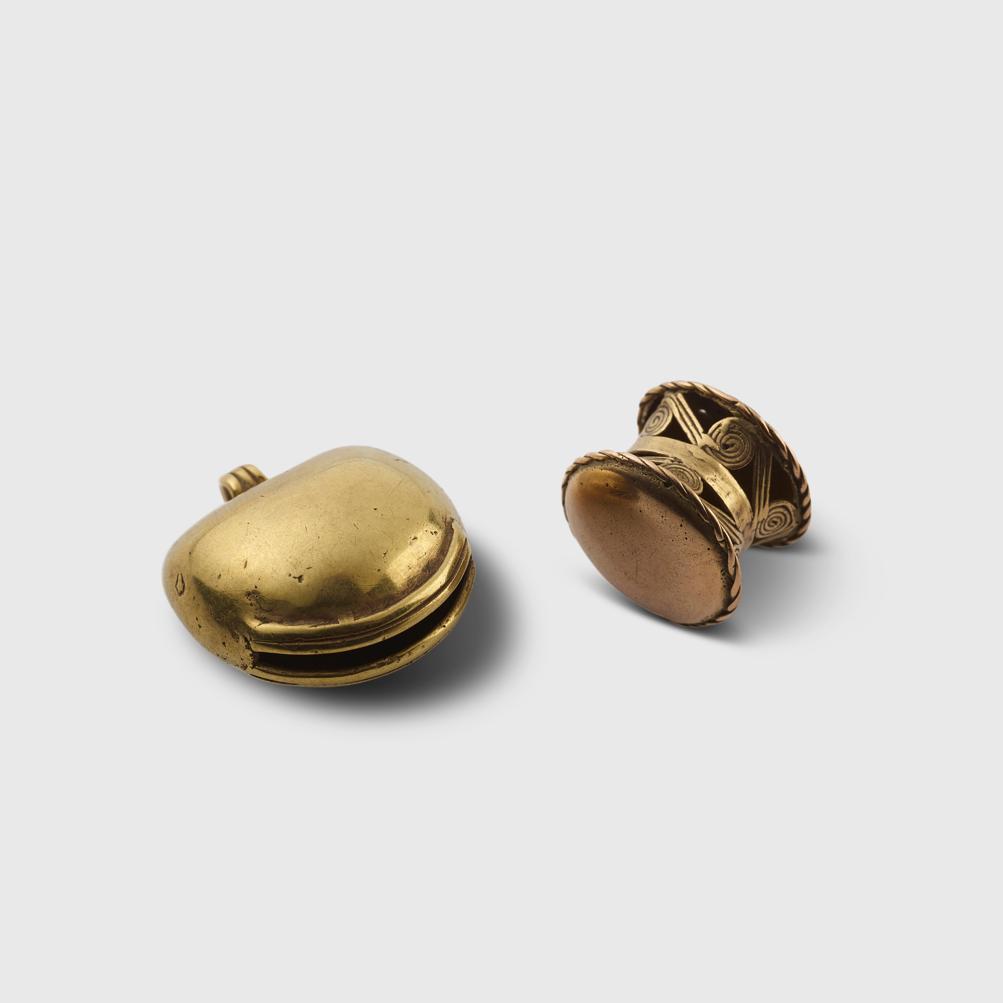A PAIR OF PRE-COLUMBIAN GOLD ORNAMENTS