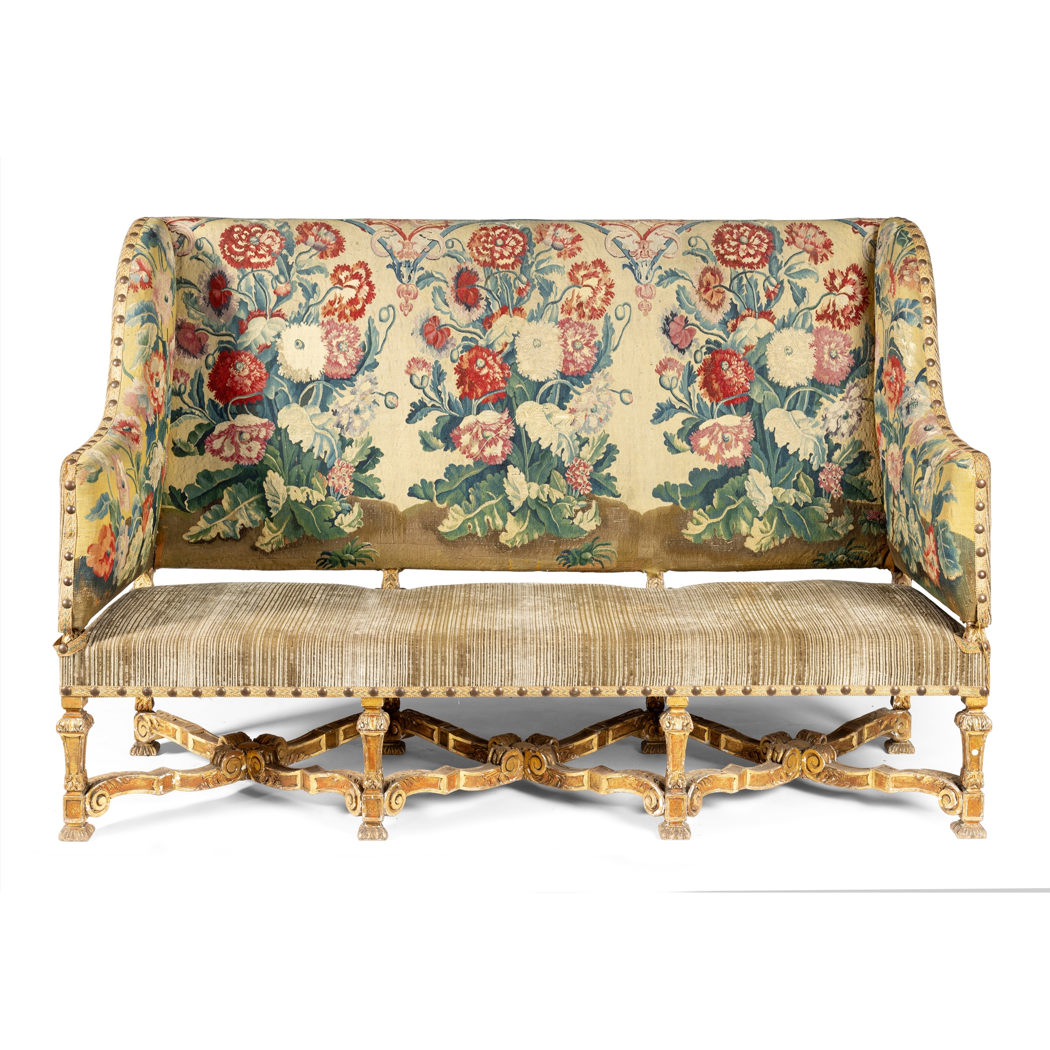A WILLIAM AND MARY STYLE UPHOLSTERED AND GILTWOOD THREE SEAT SETTEE