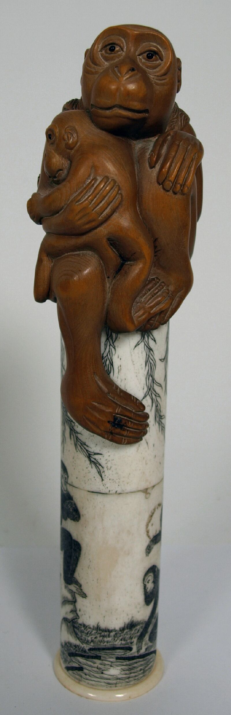 A Japanese boxwood and bone scroll case, Meiji period