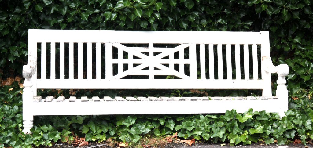 A late 19th century white painted garden bench