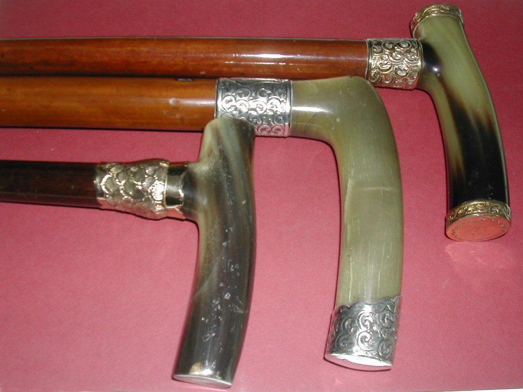 A gold mounted horn topped malacca cane,