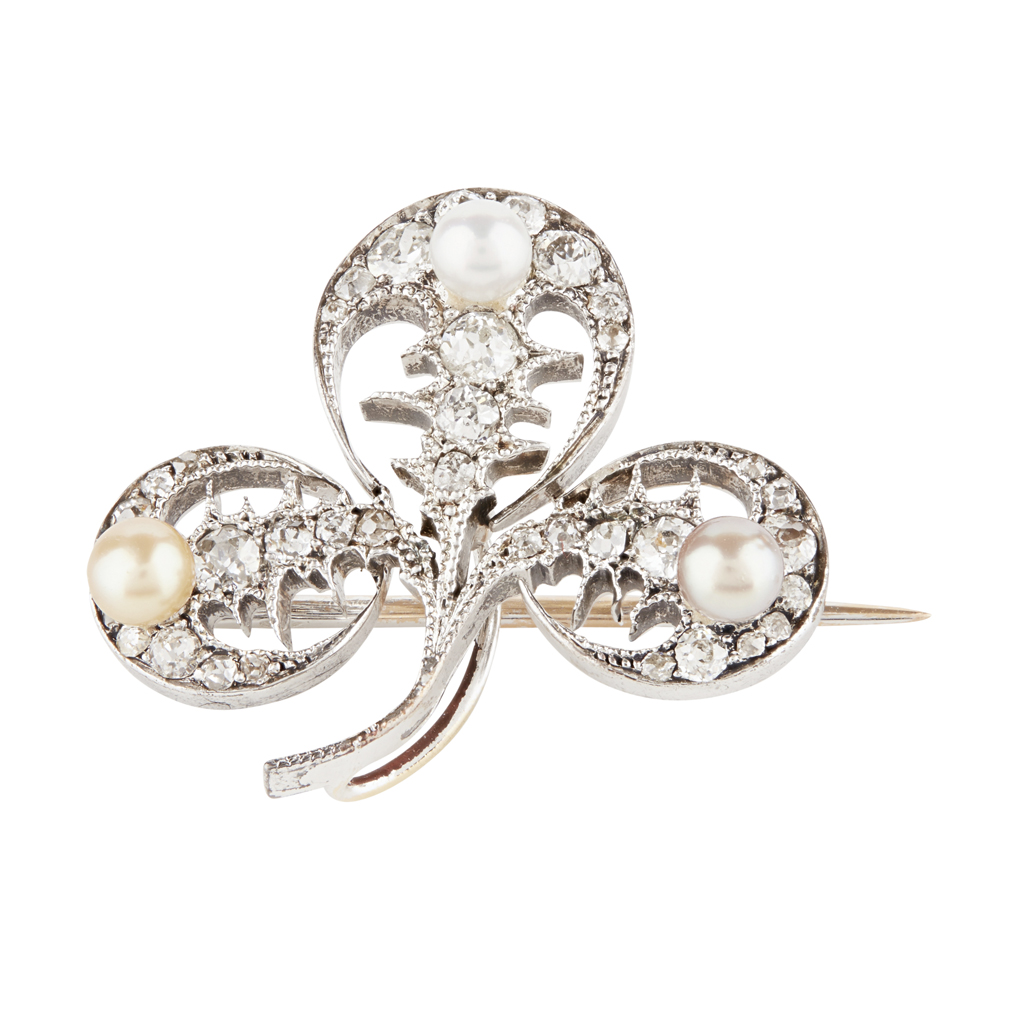 A pearl and diamond set brooch