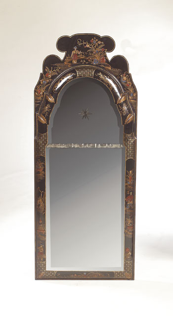 A 1920s lacquer framed mirror of Queen Anne style,