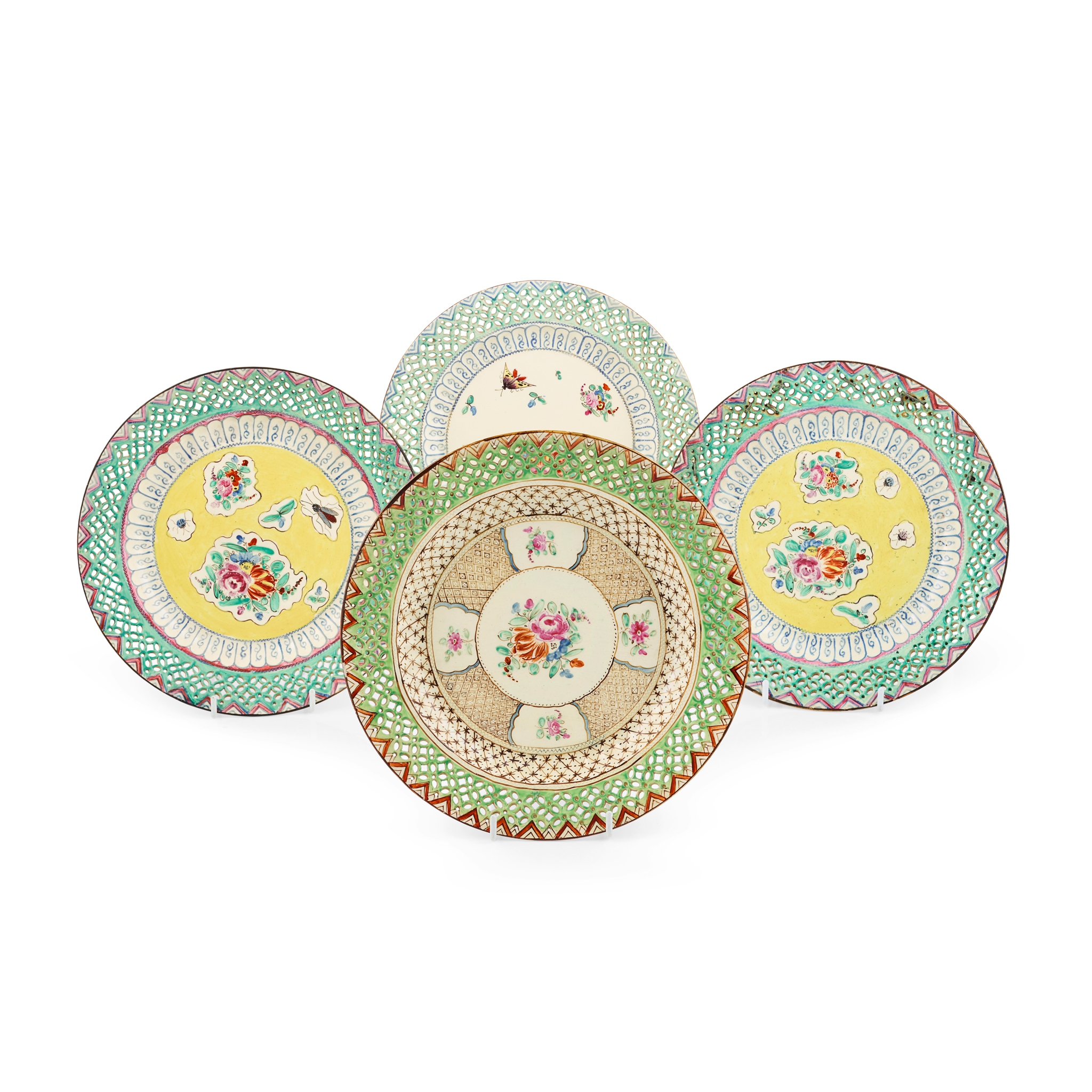 GROUP OF FOUR CREAMWARE RETICULATED AND POLYCHROME PAINTED PLATES