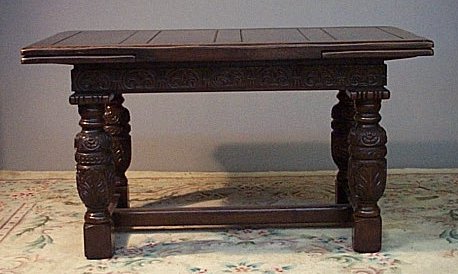 A stained oak dining table