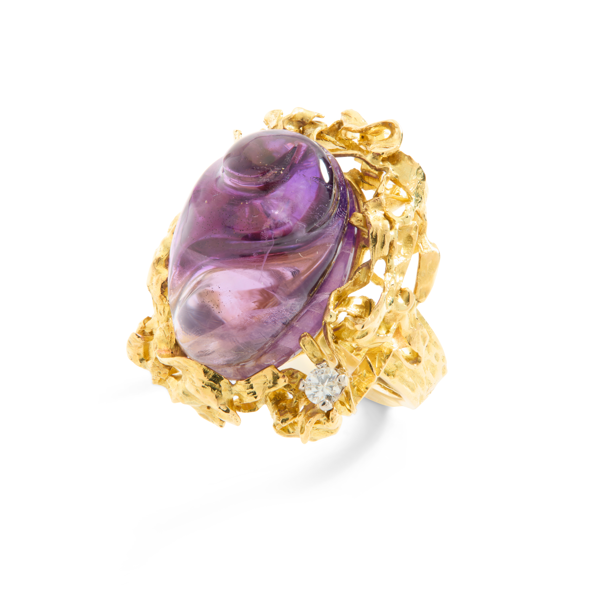A 1970s carved amethyst and diamond dress ring