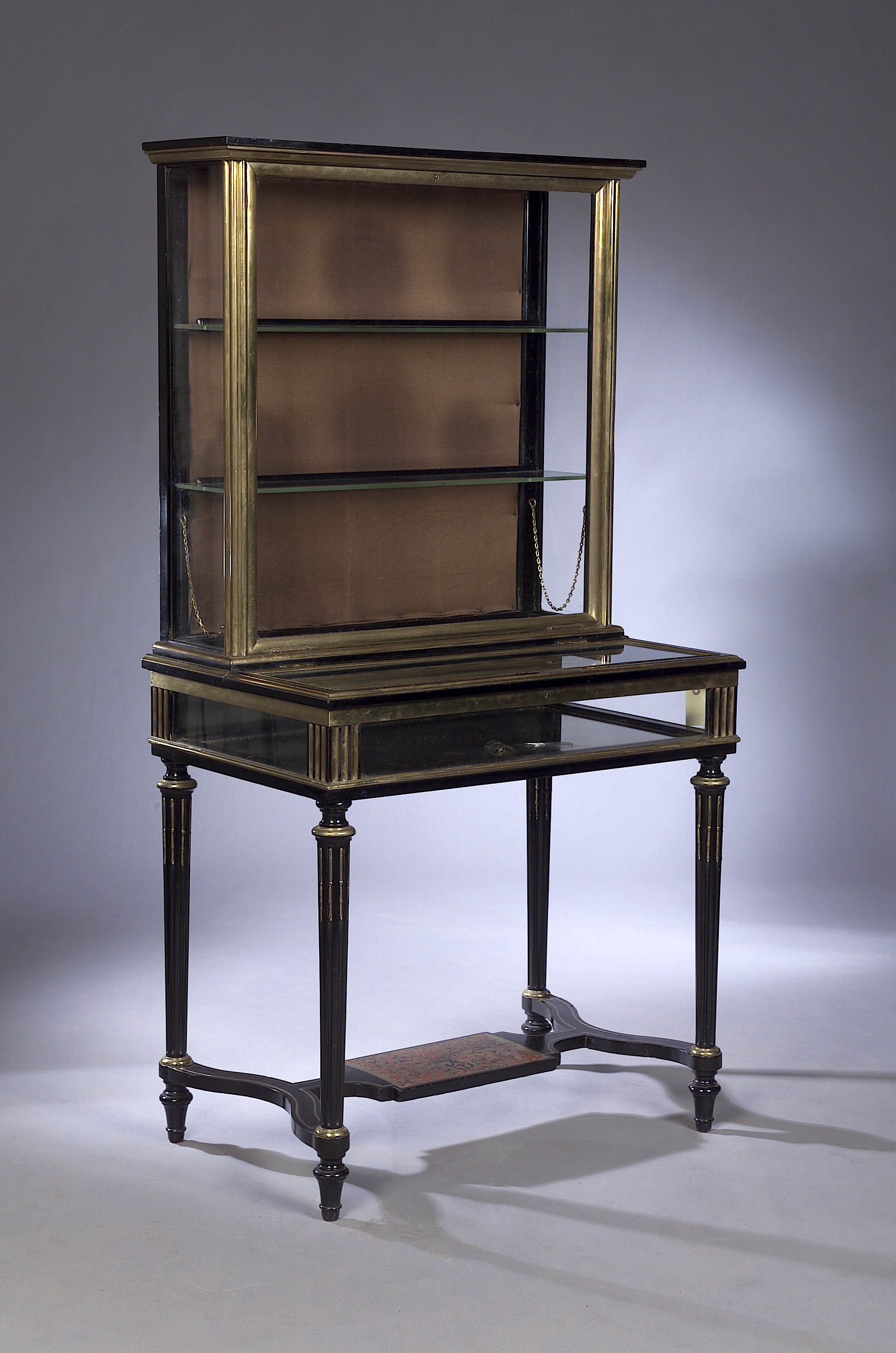 A late 19th century ebonised and brass mounted display cabinet