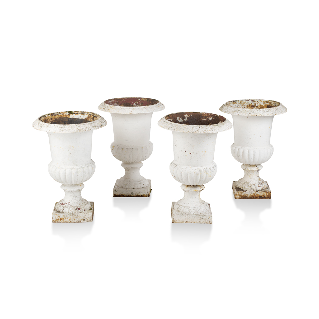 SET OF FOUR WHITE PAINTED CAST IRON URNS