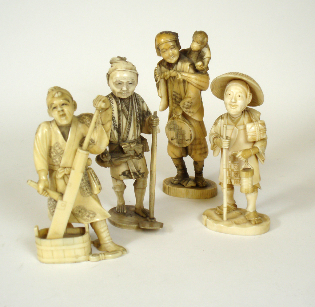 FOUR JAPANESE CARVED IVORY FIGURES