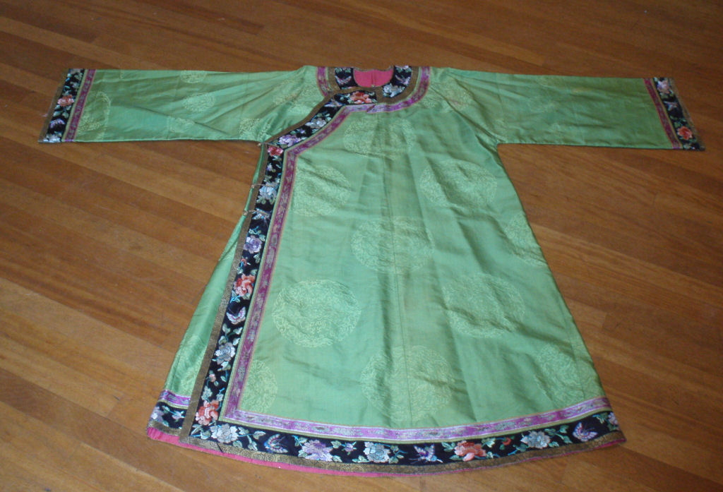 An early 20th century Chinese green silk day robe
