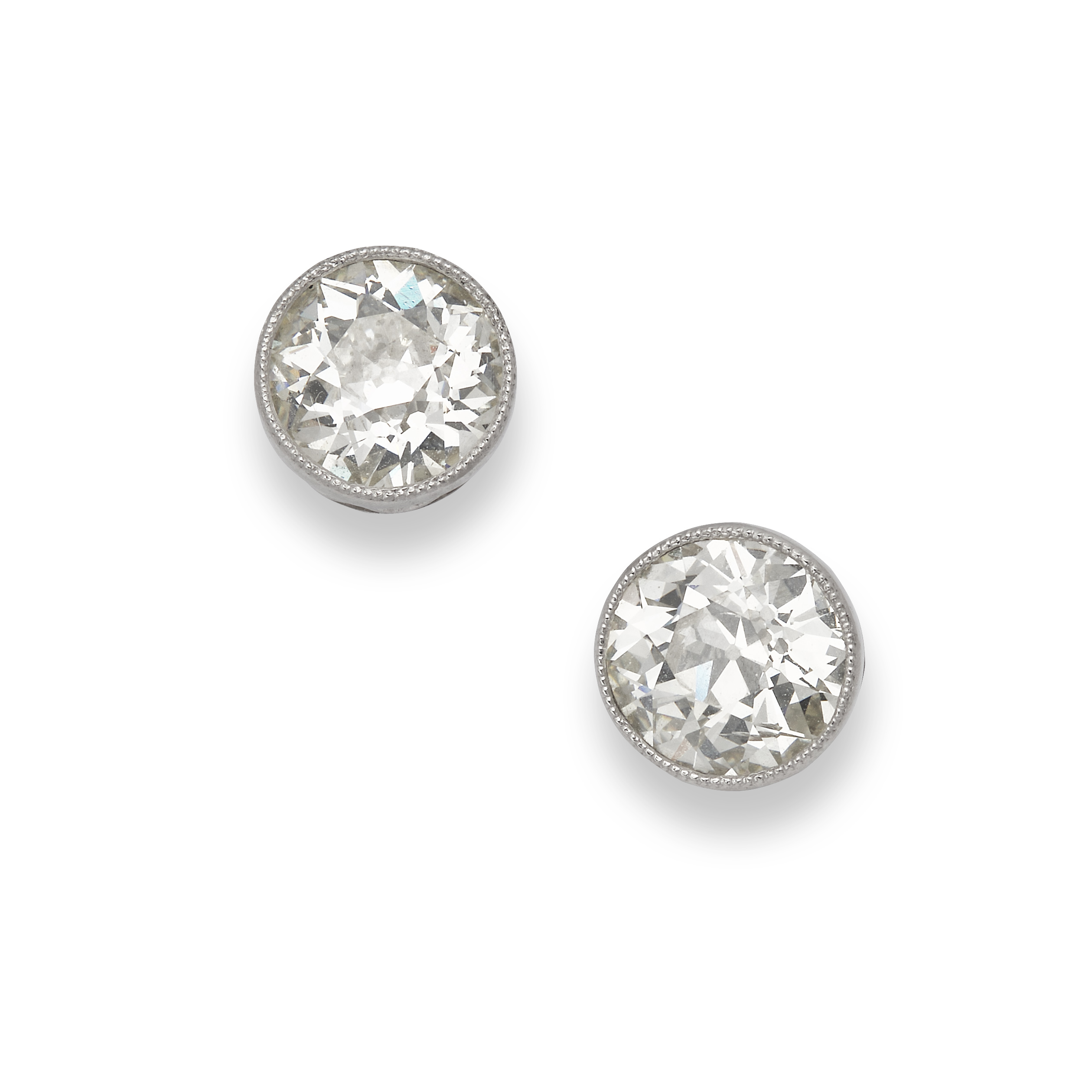A pair of early 20th century diamond stud earrings