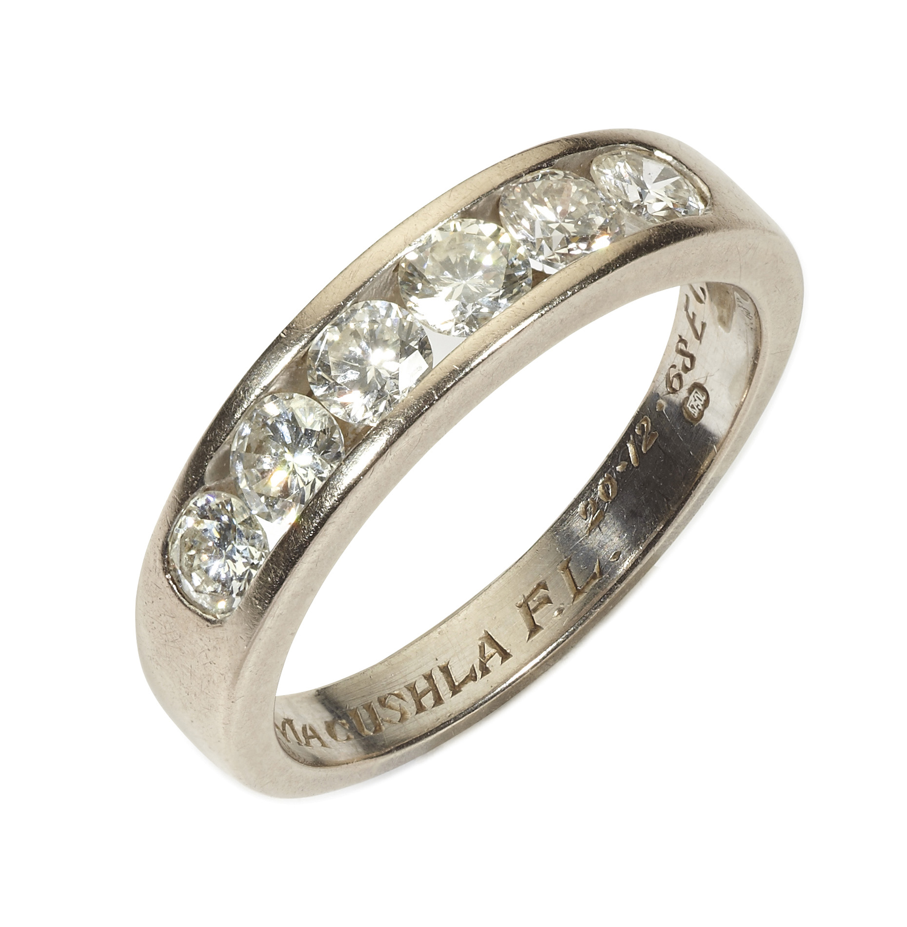 A diamond set half hoop eternity ring
