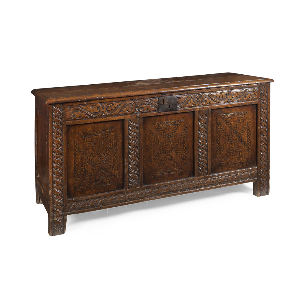 A CHARLES II CARVED OAK COFFER