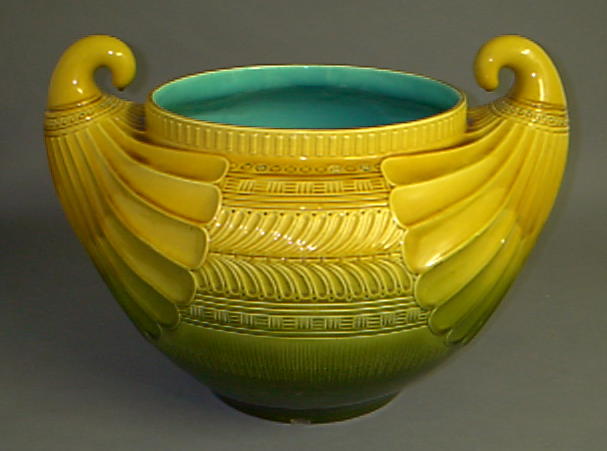 A majolica jardiniere in the style of Christopher Dresser