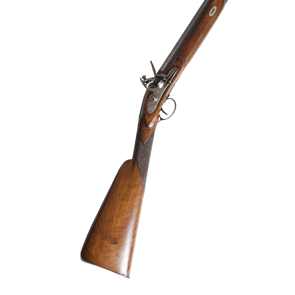 A FLINTLOCK SINGLE BARRELLED SPORTING GUN