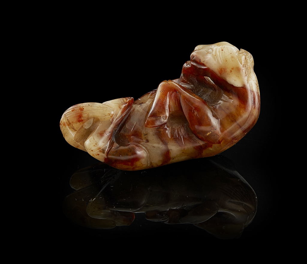 CELADON AND BROWN JADE CARVING OF A HORSE