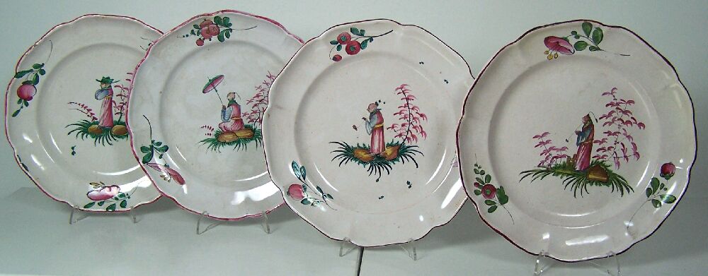 A set of four 18th century polychrome painted French faience plates