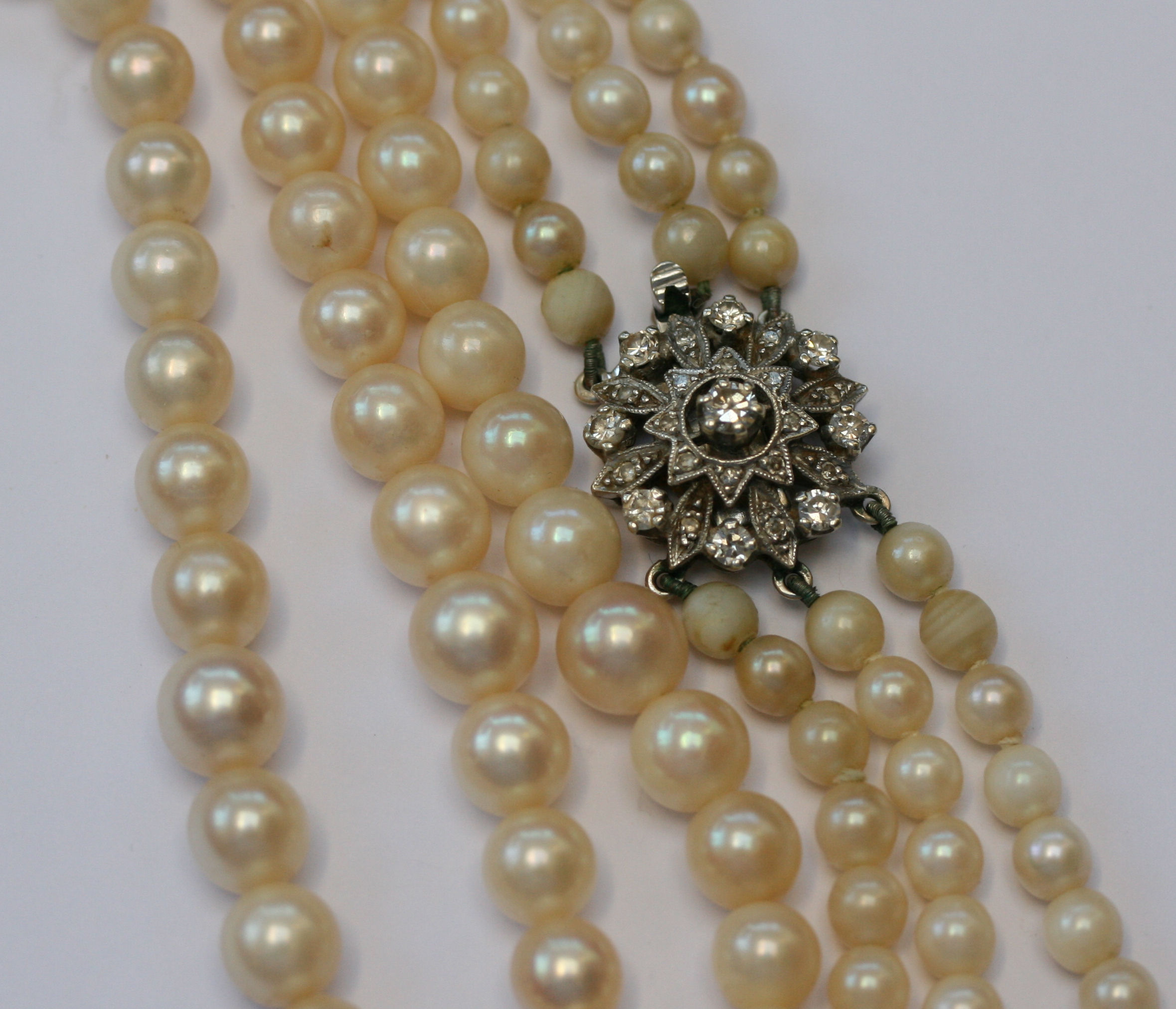 A triple strand of cultured pearls