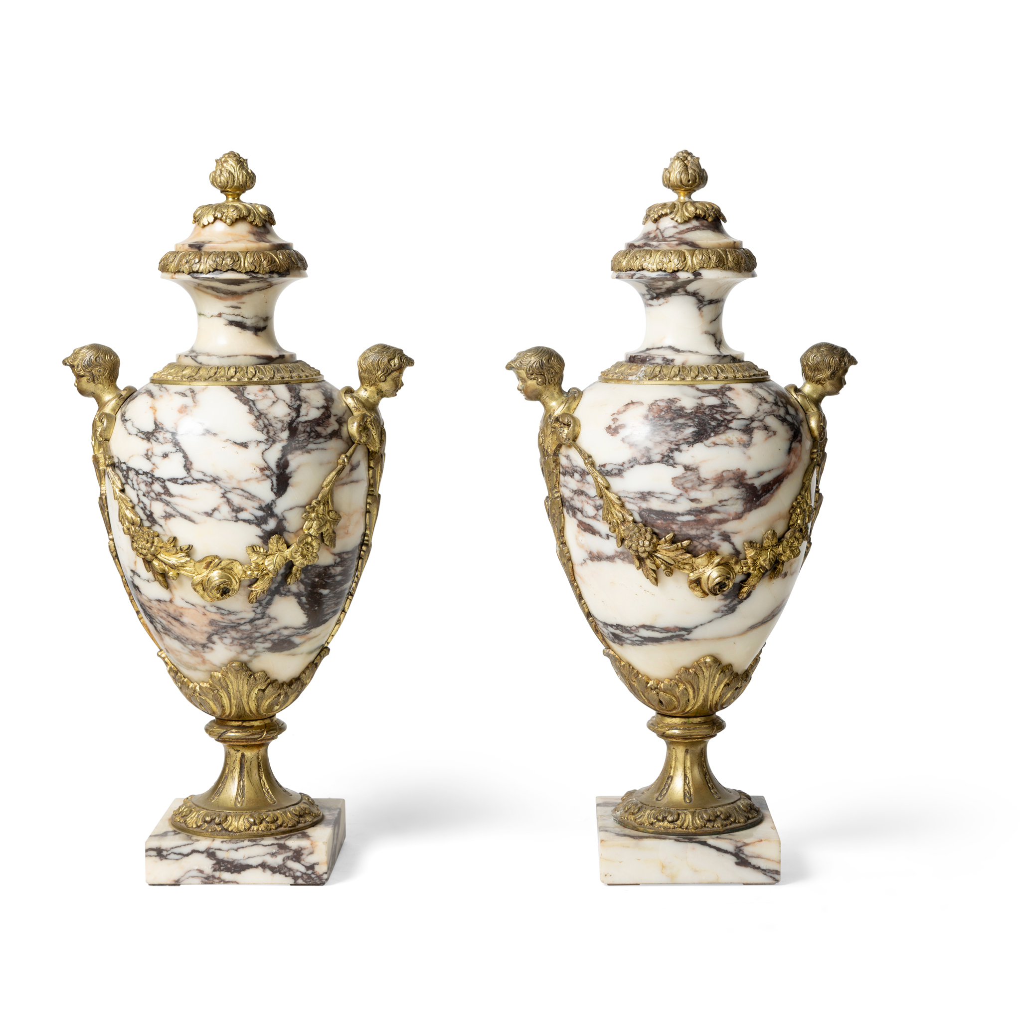 A PAIR OF VARIGATED MARBLE AND GILT METAL MOUNTED URNS AND COVER