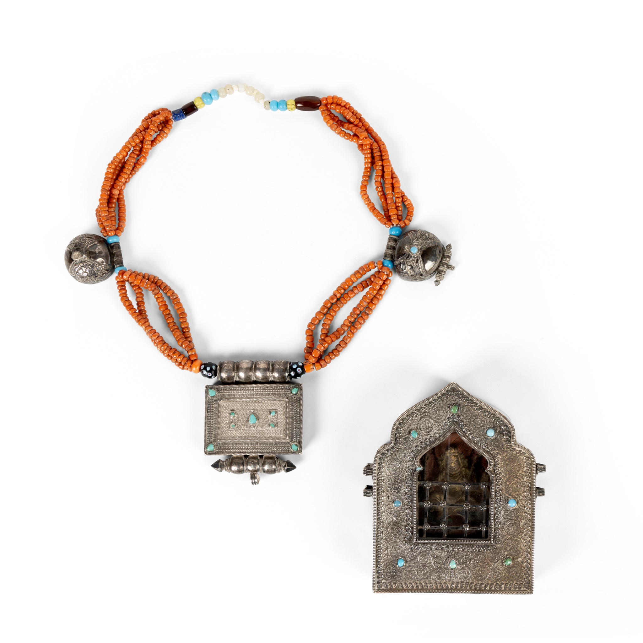 TWO TIBETAN WHITE METAL AMULETS, GAU
