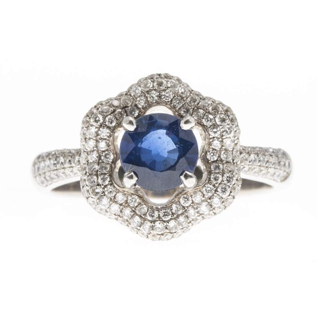 An 18ct white gold sapphire and diamond set cluster ring