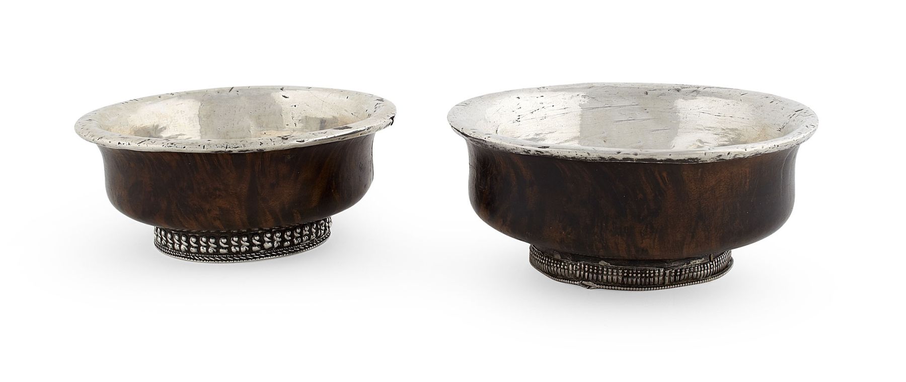 TWO TIBETAN SILVER AND BURR WOOD RICE BOWLS
