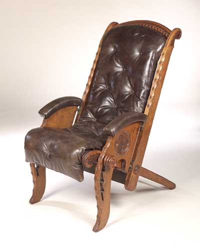 A Gothic Revival oak adjustable armchair,