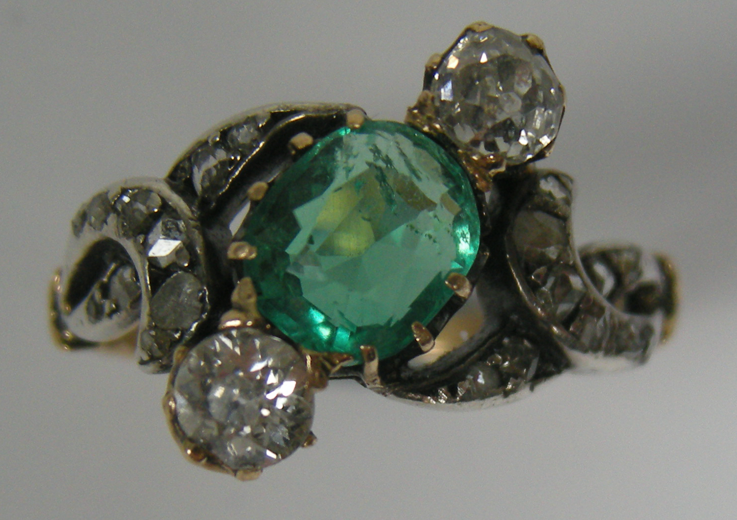 A late Victorian emerald and diamond set ring