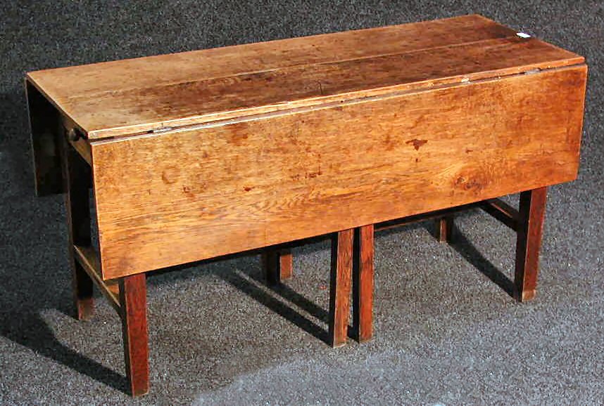 An oak gateleg refectory table,