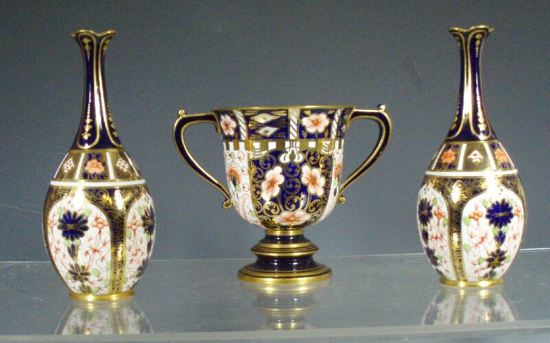 A pair of early 20th century Royal Crown Derby bottle vases