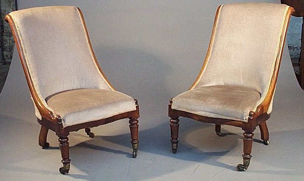 A pair of rosewood open armchairs